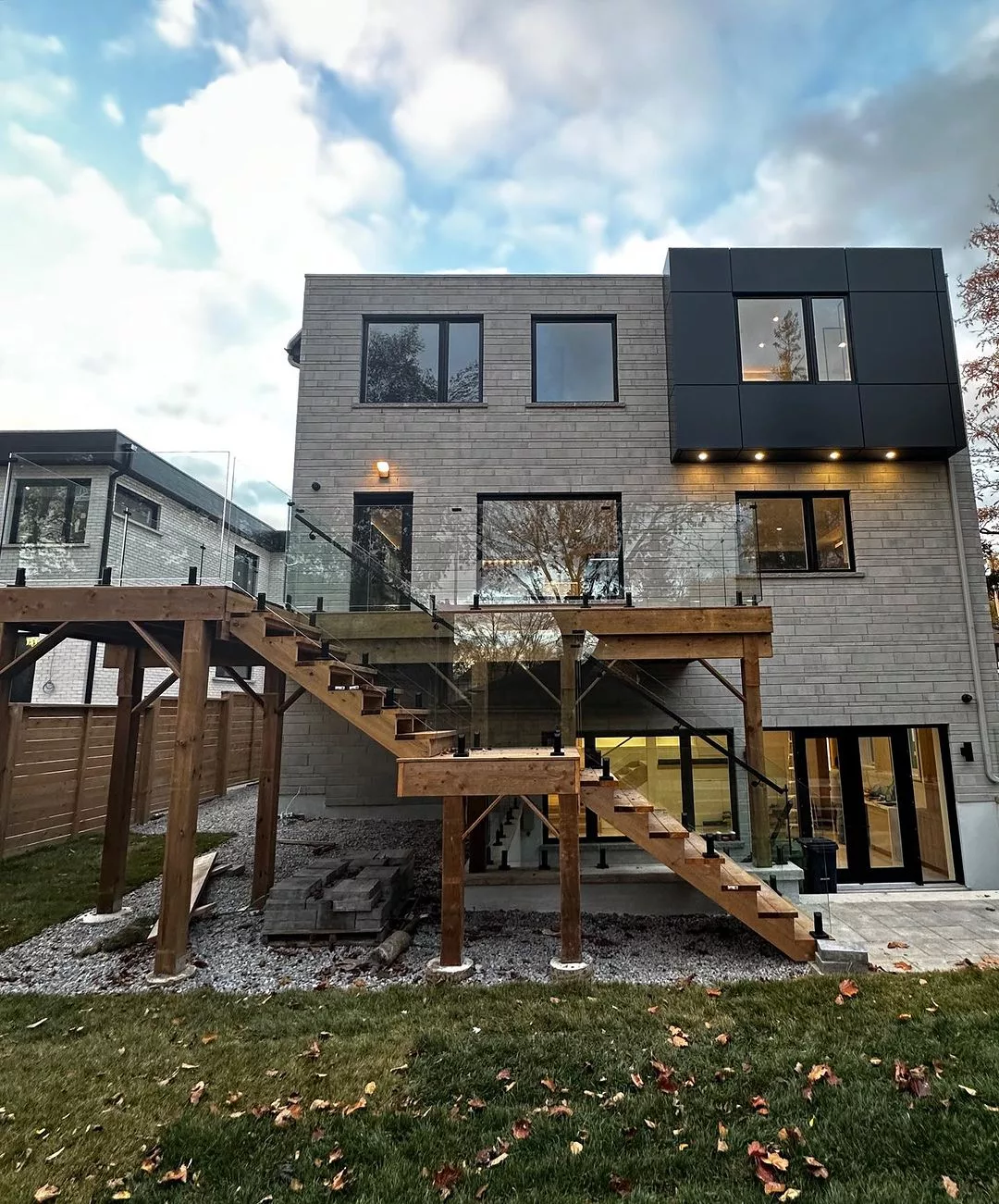 Multi-level wood deck with clear glass perimeter railings